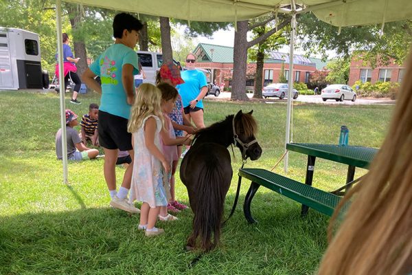 Lil' Deb hanging out with the kiddos at summer camp